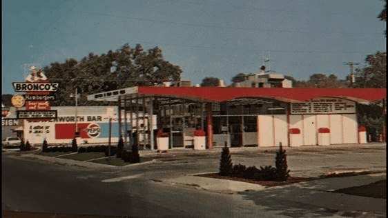 Vintage color photo of the Bronco's at 45th and Leavenworth with its red roofline and tall sign