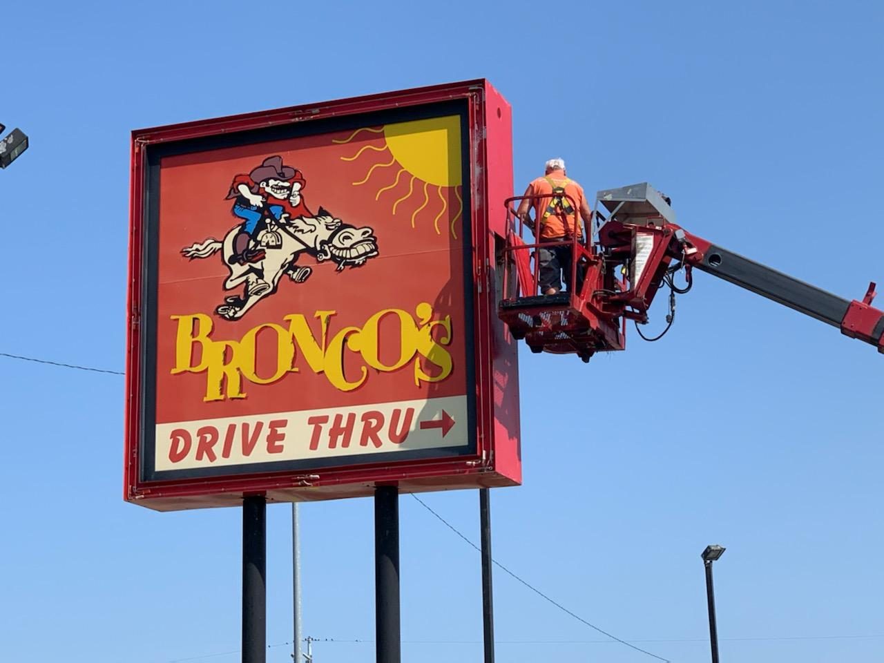 Bronco's drive-thru sign at 120th and Pacific with the cowboy riding a bronco